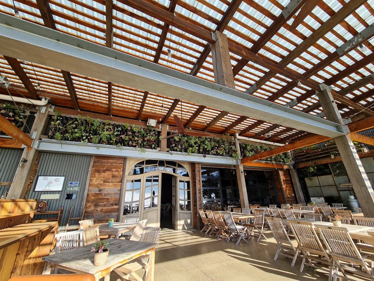 The al fresco terrace at Clyde Park Vineyard, with rooftop overhead.