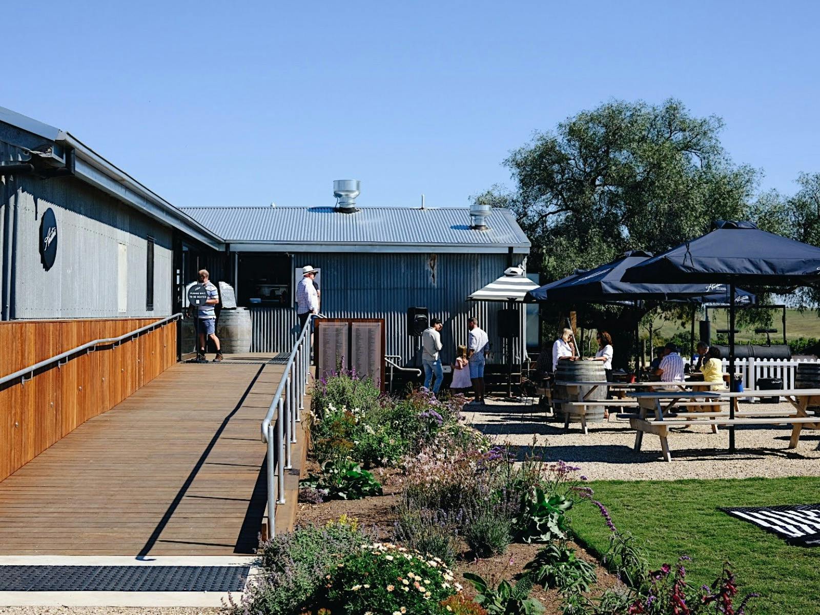 The entrance and outdoor dining at Austins Wines.